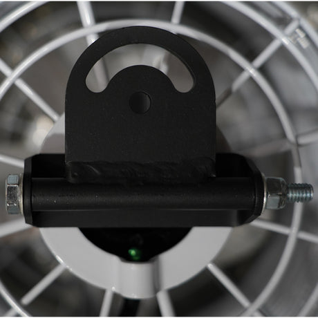 Close-up of a black metal component on a blurred metallic background