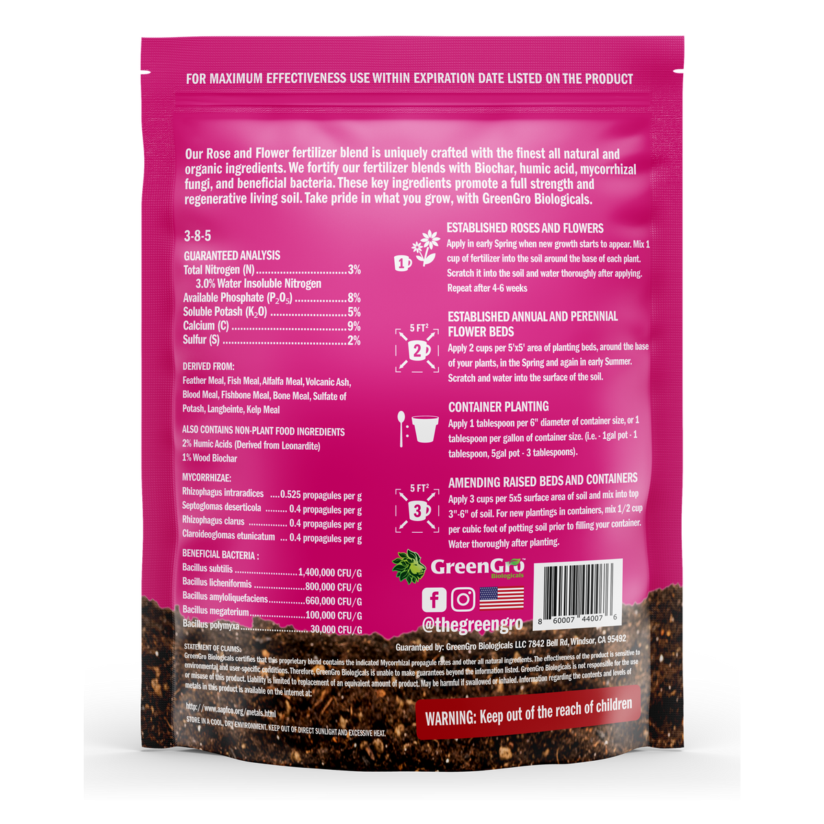 Back view of a green and pink bag of GreenGro Flower Blend fertilizer, showing detailed text, ingredients, and application instructions.