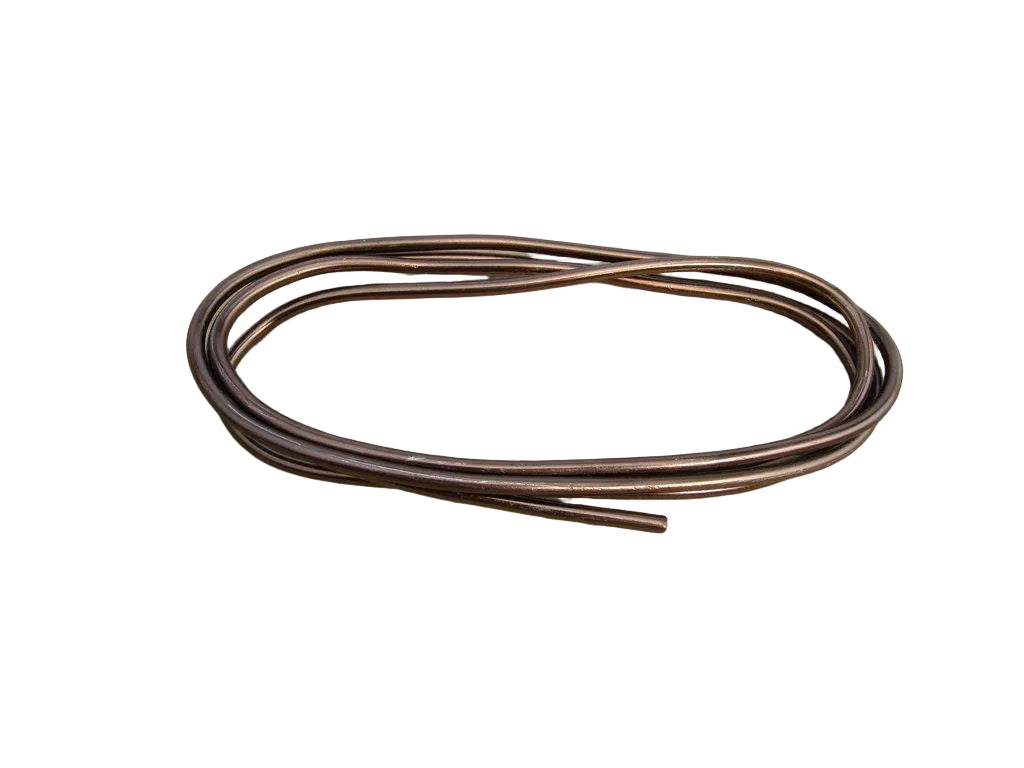Coiled brown wire on a wooden surface