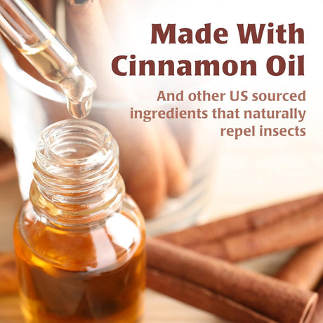 Bottle of cinnamon oil with a dropper and cinnamon sticks, labeled 'Made With Cinnamon Oil'.
