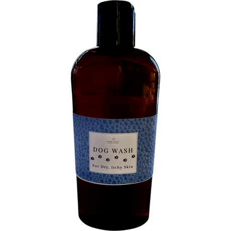 Bottle of dog wash with a label on a white background