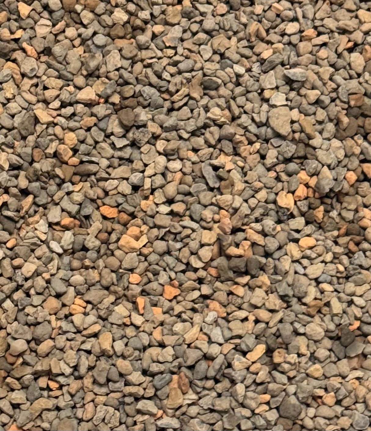 Close-up of small gravel stones with a brown and gray color.