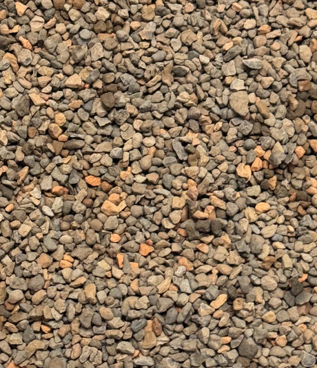 Close-up of small gravel stones with a brown and gray color.