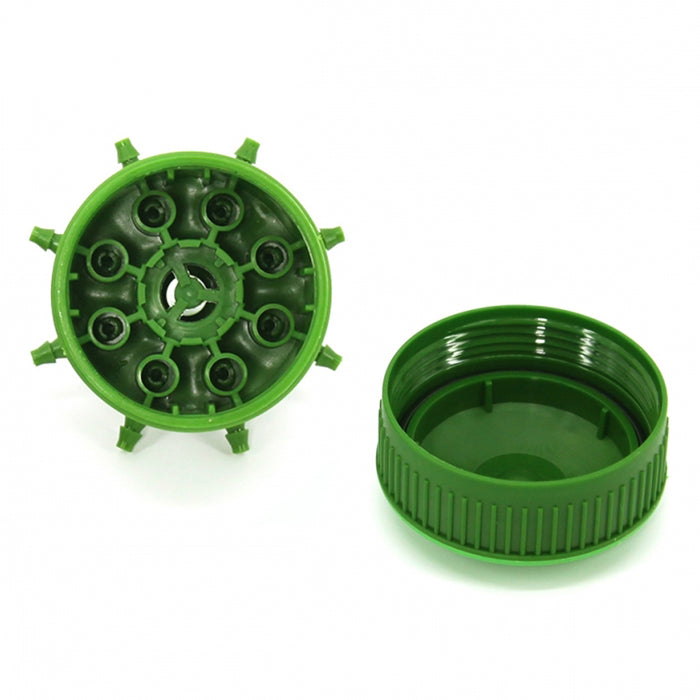 Green plastic component with multiple holes and a ribbed lid on a white background