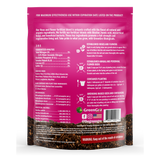 Back view of a green and pink bag of GreenGro Flower Blend fertilizer, showing detailed text, ingredients, and application instructions.