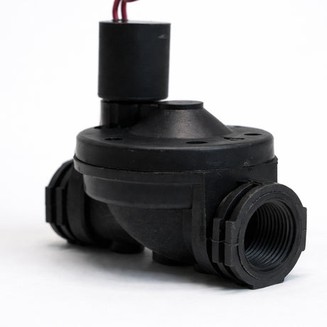 Black mechanical component on a white background