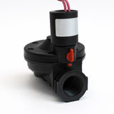 Black mechanical valve with red lever on a white background