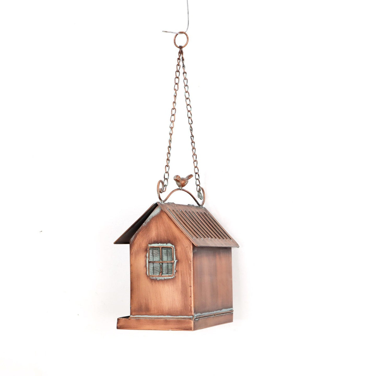 A decorative hanging birdhouse ornament with a weathered copper finish, featuring a small window and a hanging chain with a bird accent at the top, shown against a plain white background.