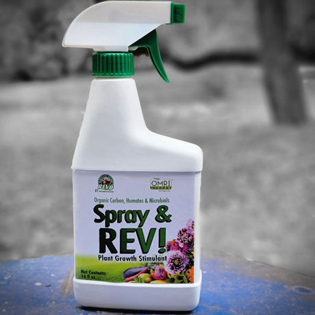 Spray & REV! plant growth stimulant bottle on a blurred background
