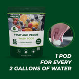 GreenGro Fruit and Veggie Wash Pods in a resealable pouch on a dark green background, with a circular inset showing a hand placing a white pod into water and large text reading '1 POD FOR EVERY 2 GALLONS OF WATER'.