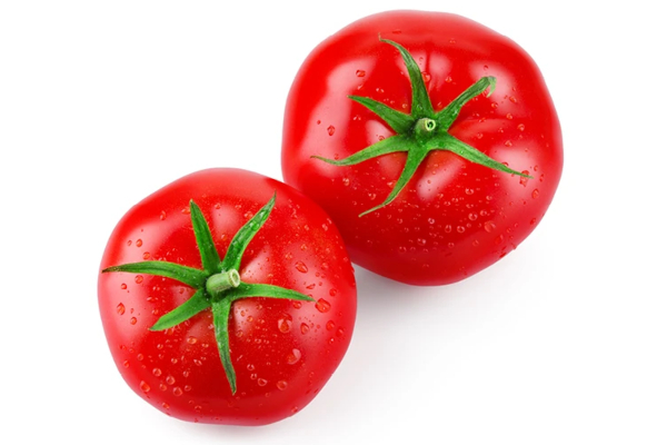two tomatoes with water droplets